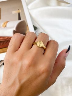 Gold ring featuring an engraved single rose ➳ Stainless steel, Ion Plated Gold ➳ Tarnish resistant ➳ Smooth polished finish ➳ Available in multiple ring sizes ➳ Gender neutral rings perfect for anyone! ❀❀ VIEW ALL RINGS: ❀❀ https://www.etsy.com/shop/bitsnpiecess/?section_id=26921609 ❀❀ VIEW MATCHING NECKLACE: ❀❀ https://www.etsy.com/listing/1292328824/stainless-steel-rose-engraved-charm?click_key=fea7a8420e8d3f4099dc9fdea520b86d664997eb%3A1292328824&click_sum=466ae9d2&ga_search_query=rose&ref=sh Rose Gold Tarnish Resistant Signet Ring, Timeless Polished Rose Gold Signet Ring, Minimalist Personalized Rose Gold Signet Ring, Minimalist Rose Gold Polished Signet Ring, Elegant Rose Gold Signet Ring, Tarnish Resistant, Multiple Rings, Signet Ring Men, Single Rose, Matching Necklaces