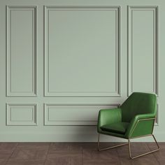 a green chair sitting in front of a wall with paneled panels on the walls