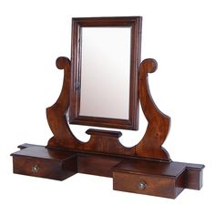 an antique wooden dressing table with mirror and drawers