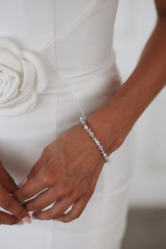 This classic and timeless bracelet with sparkling crystals and lustrous pearls features an easy-to-use clasp, perfect for adding a bit of sparkle to any outfit. Timeless White Pearl Drop Bracelet, Classic Adjustable Sparkling Bracelet, Everyday White Hand-strung Pearl Bracelet, Luxury Hand-strung Elegant Pearl Bracelet, Elegant Hand-strung Pearl White Bracelet, Pearl Veil, Veil Headpiece, Sparkling Crystal, Everyday Jewelry