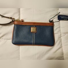 Navy Blue Leather, Nwt Dooney&Burke Wristlet. Never Been Used Blue Bags With Wrist Strap For Daily Use, Everyday Blue Pouch Wristlet, Blue Rectangular Bag With Wrist Strap, Blue Zipper Pouch Wristlet, Blue Rectangular Wristlet With Removable Pouch, Blue Rectangular Wristlet For Everyday Use, Blue Elegant Wristlet For Everyday Use, Elegant Blue Wristlet For Everyday Use, Dooney And Bourke Disney