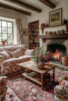 a living room filled with furniture and a fire place in the middle of a room