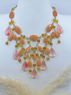 Jewels that glow as bright as the autumn sun 🍂. Handcrafted using pink, orange, yellow Austrian crystals and gold detailing. Lover Necklace, Autumn Sun, Lovers Necklace, Pink Orange Yellow, Tropical Island, Orange And Yellow, Austrian Crystal, The Caribbean, Summer Season