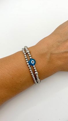 Evil Eye Stacked Bracelets, Stainless Steel Beaded Non Tarnish Bracelet, Evil Eye Jewelry, Good Luck, Bohemian stretch bracelets, Unisex +Materials 4 an 6mm Stainless Steel round beads 10mm Turquoise Blue Evil Eye Glass bead +Size XSmall 6 inches Small 6.5 inches Medium 7 inches Large 7.5 inches XLarge 8 inches If you are not sure about your size please contact me. How to care your bracelet In order to enjoy and use for long time please  >Keep your bracelet in its plastic bag when it is not in u Silver Beaded Wristband As Gift, Silver Beaded Wristband For Gifts, Adjustable Silver Evil Eye Bracelet Gift, Metal Stretch Bracelet With Silver Beads, Silver Hypoallergenic Friendship Bracelets With Round Beads, Metal Stretch Bracelet Stackable Gift, Handmade Metal Evil Eye Bracelet For Gift, Metal Stretch Bracelet With Round Beads For Gift, Silver Evil Eye Bangle Bracelet For Gift