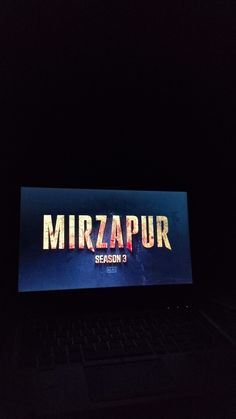 a laptop computer sitting on top of a desk in front of a screen with the words mirapurr