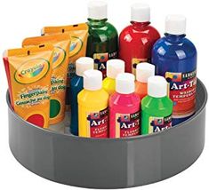 a cup filled with lots of different types of paints and condiments in it