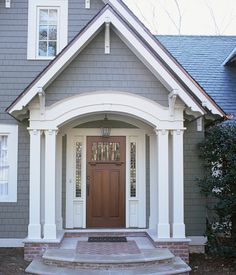 a house with a front door and steps leading up to it