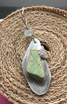 This beautiful piece of sea pottery was found by myself on a beach on the East Coast of Scotland. It is a lovely apple green colour, and probably started off life as a tile. I have sawn out a complementary shape from a sheet of .925 sterling silver, and created a bezel with fine silver.  The word "bee" has been stamped below the sea pottery, and a small silver bee, which I have cast myself, has been soldered on to the side of the bezel. A piece of seafoam sea glass, also found by myself on a bea Confirmation Sponsor Gifts, Confirmation Jewelry, Godmother Gifts, Sea Pottery, Sea Glass Necklace, Apple Green, Delicate Earrings, Opal Necklace, Turquoise Sterling Silver