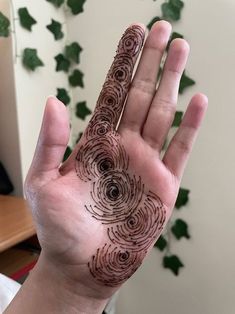 a person's hand with a tattoo on it that has circles drawn on it