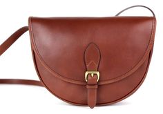 a brown leather bag with a gold buckle on the front and shoulder strap that is attached to it