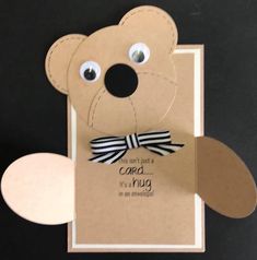 a card with a teddy bear made out of cardboard and some googly eyes on it