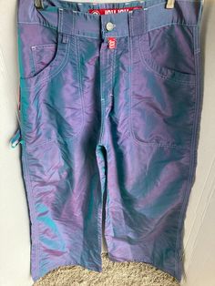 Purple and teal pants Y2k Style Green Pants For Fall, Y2k Green Pants For Fall, Green Y2k Pants For Fall, 90s Style Green Wide-leg Pants, 90s Style Green Wide Leg Pants, 90s Green Wide Leg Pants, 90s Style Stretch Pants With Pockets, 90s Stretch Pants With Pockets, 90s Style Green Pants With Pockets