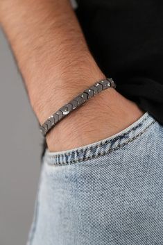 Introducing our Men's Colorfast Natural Stone Bracelet - a perfect blend of style and durability. Crafted with precision, this bracelet features genuine natural stones that not only add a touch of sophistication but also offer timeless elegance. What sets it apart is its colorfast technology, ensuring the vibrancy of the stones remains intact, resisting fading over time. The sturdy construction and adjustable fit make it a versatile accessory for any occasion, adding a masculine and refined touch to your look. Elevate your style with the enduring charm of our Men's Colorfast Natural Stone Bracelet. Modern Hematite Bracelets As A Gift, Adjustable Hematite Bracelets, Adjustable Magnetic Minimalist Jewelry, Minimalist Magnetic Adjustable Jewelry, Minimalist Magnetic Jewelry, Modern Silver Hematite Bracelets, Silver Minimalist Magnetic Bracelet, Minimalist Silver Magnetic Bracelet, Minimalist Magnetic Silver Bracelet