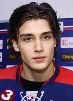 a close up of a person wearing a jersey and looking at the camera with an intense look on his face