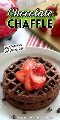 chocolate chipped waffles with strawberries on top and chocolate chips in the background