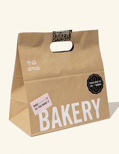 a brown paper bag with the word bakery printed on it's front and bottom