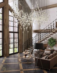 an elegant living room with chandelier and stairs