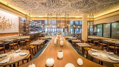 an empty restaurant with tables and chairs