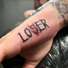 a person with a tattoo on their arm that says,'looper'in black ink