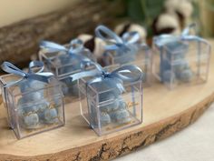 small clear boxes with blue candies in them