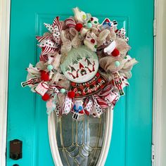 a christmas wreath is hanging on the front door