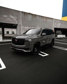 a silver suv parked in a parking lot