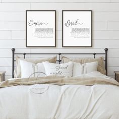 a bed with two framed pictures above it