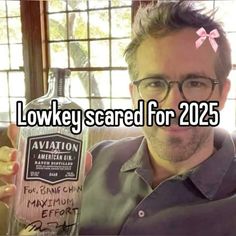 a man holding up a bottle of alcohol in front of his face with the caption, low key scared for 205