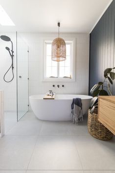 a white bath tub sitting next to a window