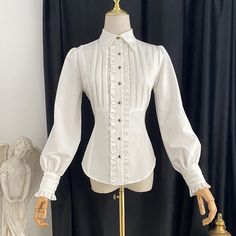 A blouse that looks like an aristocratic lady from medieval Europe. A gorgeous item decorated with frills and pleats on the chest. The cuffs are long and the waist is tapered. For a young lady with a noble atmosphere. 
 

 

 
 
 
 Color 
 
 White 
 pink 
 Gray 
 Navy 
 
 
 Size 
 
 
 S size 
 
 Length: 59cm 
 Shoulder width: 35-37cm 
 Bust: 86cm 
 Waist: 68cm 
 Sleeve length: 61cm 
 
 M size 
 
 Length: 60cm 
 Shoulder width: 36-38cm 
 Bust: 92cm 
 Waist: 74cm 
 Sleeve length: 61.5cm 
 
 L size Pink Blouse, Pink Grey, No Frills, Long Sleeve Blouse, Long Sleeves, Cuff, Sleeve Length, Couture, Navy