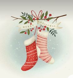 two christmas stockings hanging from a twig with holly and mist on it's side