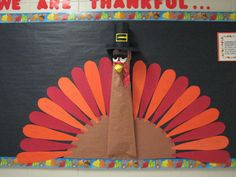 a turkey made out of paper on a bulletin board