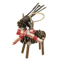 an ornament made out of pine cones and plaid ribbon with a bird on top