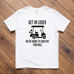 a white t - shirt that says get in closer we're going to look for your ball