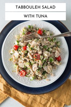 tabbouleh salad with tuna on a white and blue plate next to a yellow napkin