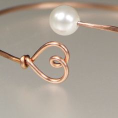 This dainty bangle bracelet is handmade with 14k rose gold and pearl. It is a perfect gift for your loved one, for family, for the bridesmaids, for birthday. The copper anniversary which is the 7th anniversary in the U.S, and in the U.K the copper anniversary is the 9th anniversary. And this hand stamped copper bracelet comes with a pretty box for gifting.This copper personalized initial bracelet stacks great with other bangles from my collection. Enjoy stacking your copper bracelet for the laye Minimalist Pearl Bangle Bracelet Gift, Elegant Handmade Bracelets As Bridesmaid Gift, Elegant Handmade Bracelets For Bridesmaids, Delicate Pearl Bangle Bracelet As Gift, Handmade Rose Gold Pearl Bracelet Gift, Elegant Rose Gold Bangle For Gift, Delicate Pearl Bangle Bracelet, Simple Rose Gold Jewelry For Bridesmaid Gift, Dainty Pearl Bracelet For Valentine's Day