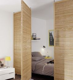 a bedroom with wooden slats on the walls