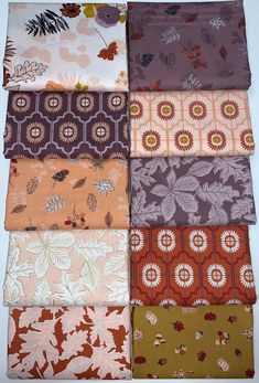 six different colors of fabric with leaves and flowers on them, all laid out in rows