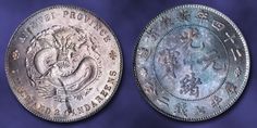 two old chinese silver coins on a blue background