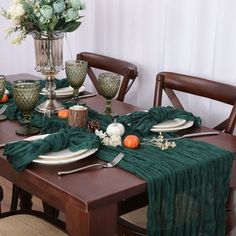 the table is set with dishes and place settings