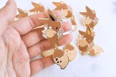 Eevee Dangling Tail Enamel Pins 3.5 POKEMON | Etsy Pokemon Enamel Pin, Pokémon Collage, Eevee Keychain, Pokemon Merch, Pokemon Ash And Serena, Pokemon Pins, Pokemon Wallpaper