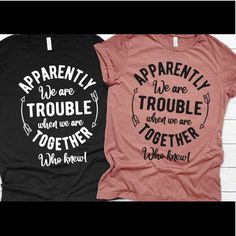 two t - shirts that say, apparently we are trouble when we are together and no reason