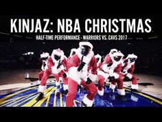 a group of men in santa suits on top of a basketball court with the words kindaz nba christmas