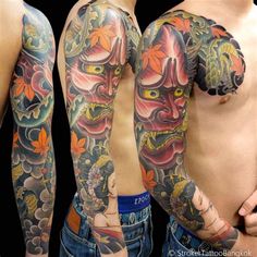 two men with tattoos on their arms and chest