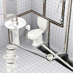 a white toilet sitting inside of a bathroom next to a sink and shower head mounted on a wall