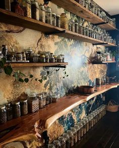 there are many jars on the shelves in this room