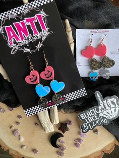 "Haunt Me Valloween Dangles - Black Lace Brides Approx 3.5\" long Pink Jackolantern Heart Irradecent Heart Black Glitter Skull  Plated Rose Gold Earring Hooks All earrings are made with gold plated sterling silver hooks. Nickle Free. PLEASE SHARE! :) & Let's Be Friends! IG: BlackLaceBrides IG: Black.Lace.Designs USE: #BlackLaceBrides  DM / TAG to be features" Pink Jackolantern, Glitter Skull, Rose Gold Earring, Lace Designs, Lace Bride, Gold Earring, Pink Earrings, Earring Hooks, Black Glitter