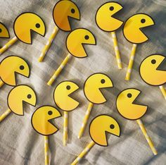 many yellow stick shaped like ducks on a table