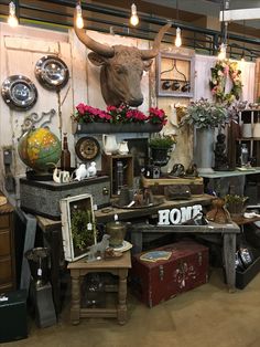 a room filled with lots of different types of furniture and decor on top of each other