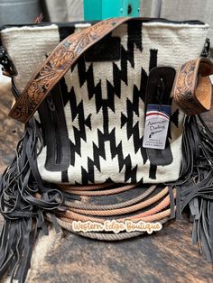 A hand weaved woolen saddle blanket gives the bag a western traditional yet trendy and elegant look. .The bag is decorated with a beautiful leather fringe giving it a western look.Tooled and painted Leather is a vegetable tanned Cowhide Leather with nature-inspired engravings..YKK well known long lasting and durable zipper closures ensure security of your essentials.The shoulder straps are adjustable and made of 100% genuine Full grain leather.The bag is spacious enough to carry a lot of stuff. Western Brown Bag With Fringe, Brown Western Bag With Fringe, Western Style Fringe Bags For Everyday Use, Western Style Fringed Bags For Everyday Use, Western Style Bags With Fringe For Everyday Use, Saddle Blanket, Tan Cowhide, Western Look, Painting Leather